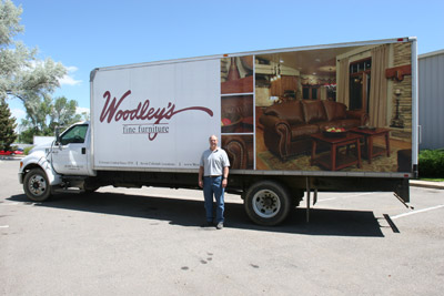 Woodley's-Truck-with-Driver-in-Front-in-Longmont-CO