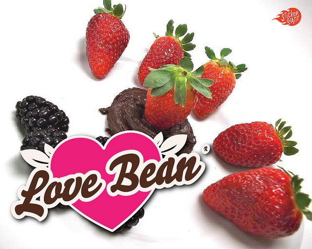 Lovebean-Custom-Shaped-Stickers-Printed-by-StickerGiant-with-strawberries-and-chocolate-in-the-background