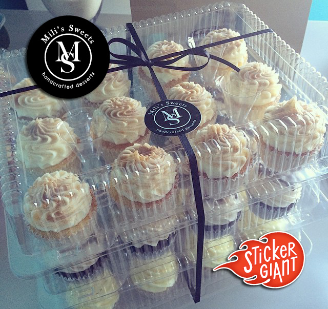 Custom-stickers-for-Mili's-Sweets-Bakery-with-a-freshly-packed-stacked-of-cupcakes-in-the-background