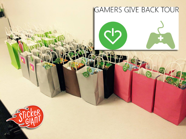 Gamers-Give-Back-Tour-custom-stickers-with-donation-bags-in-background