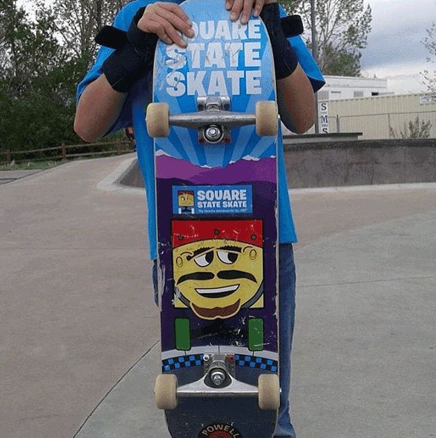 Kid-holding-a-skateboard-that-has-a-Square-State-Skate-custom-sticker-on-the-board