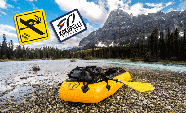 Stickers-in-front-of-mountains-custom-logo-stickers-have-a-Kokopelli-rafting-printed-by-StickerGiant-for-Kokopelli-Packraft