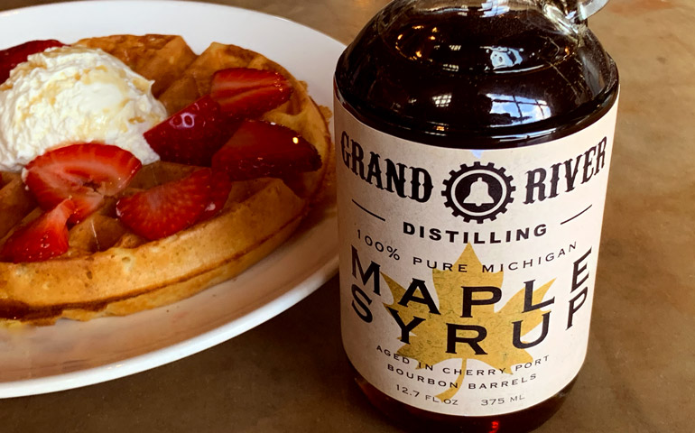 Grand-River-Distilling-Shows-their-Product-Label-Printed-by-StickerGiant-on-a-Maple-Syrup-Bottle-with-Waffles