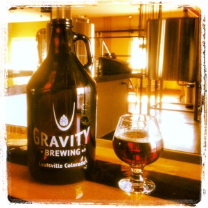 gravity-brewing-company-sticker-story-pic-with-growler-and-anice-filter-with-pint-glass-sitting-on-bar