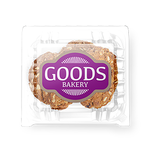 A clear container of cookies with a Goods Bakery logo printed by StickerGiant applied to it