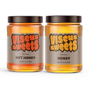 Two glass jars with Viscus Sweets labels printed by StickerGiant applied to them, one is for hot honey and one is honey